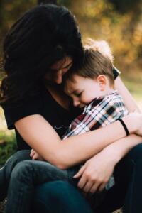 Mother and child hugging