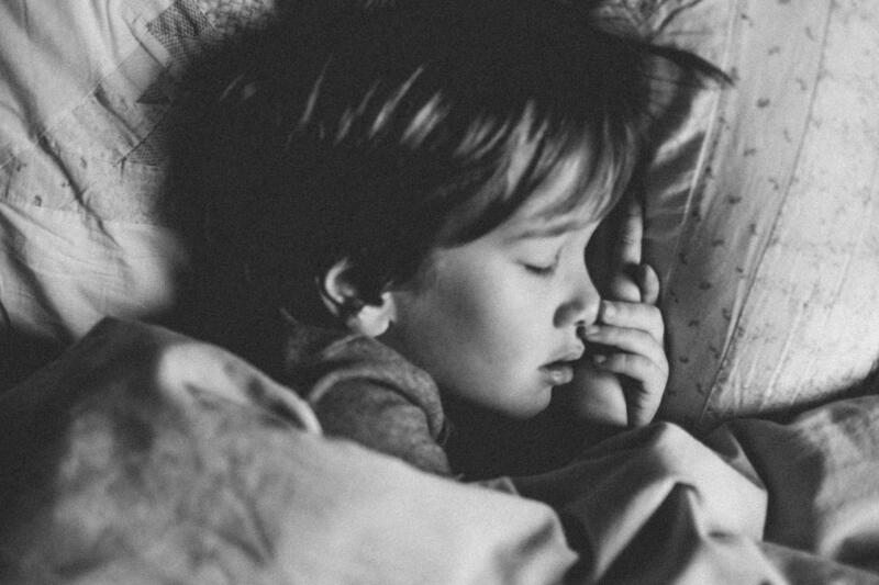 Little boy sleeping, black and white photo